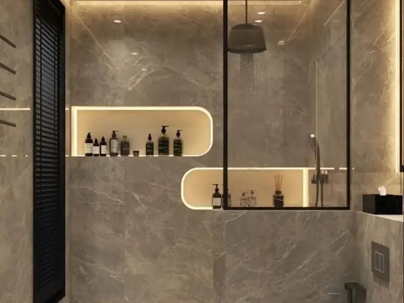 Baño con nichos curvos iluminados